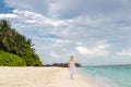 Woman in a white dress on the tropical beach Royalty Free Stock Photo