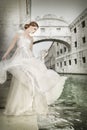 Woman in white dress, in Venice, Italy