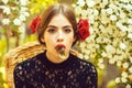 Woman with white flower in mouth on thoughtful face Royalty Free Stock Photo