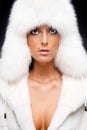 Woman in white fur coat and cap Royalty Free Stock Photo