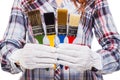 Woman with white glove and colorful paintbrushes