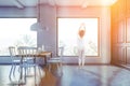 Woman in white and gray dining room Royalty Free Stock Photo