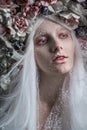 Woman with white hair and white roses Royalty Free Stock Photo