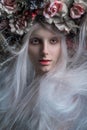 Woman with white hair and white roses and snow Royalty Free Stock Photo