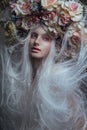 Woman with white hair and white roses and snow Royalty Free Stock Photo