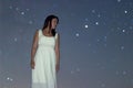 Woman in white long dress under starry night Woman under night sky, Royalty Free Stock Photo