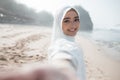 Woman in white scarf taking selfie Royalty Free Stock Photo