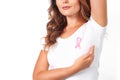 Woman in white t-shirt with pink ribbon supporting breast cancer awareness campaign