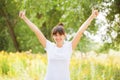 Woman in white t-shirt showing a thumbs up