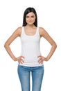 Woman is in a white tank top and blue denims. Isolated. Royalty Free Stock Photo