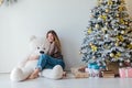 beautiful woman with a white teddy bear for Christmas Royalty Free Stock Photo