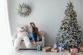 beautiful woman with a white teddy bear for Christmas Royalty Free Stock Photo