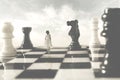 Woman who is allied with the white chessboards looks suspiciously at her black rival Royalty Free Stock Photo