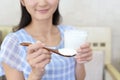 Woman who eats yogurt Royalty Free Stock Photo
