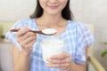 Woman who eats yogurt Royalty Free Stock Photo