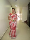 Woman who is looking very beautiful standing in hotel wearing indian shari