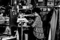 Woman who is in old roadside computing in Liwan District, Guangzhou,China