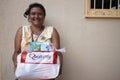 A woman who received a basic food kit donation Royalty Free Stock Photo