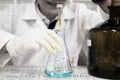 The woman who's the scientist is doing the experiment, the titra Royalty Free Stock Photo