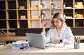 Woman who is tired and overthinking from working with tablet and laptop at office Royalty Free Stock Photo