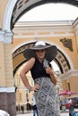 Woman in a wide-brimmed hat and long dress Royalty Free Stock Photo