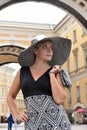 Woman in a wide-brimmed hat and long dress Royalty Free Stock Photo