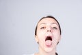 Woman with Wide Open Mouth Looking at Camera Royalty Free Stock Photo