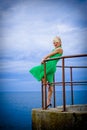 Woman at windy seaside