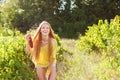 Woman winegrower picking grapes at harvest time