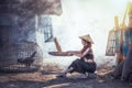 Woman winnowing rice separate between rice and rice husk