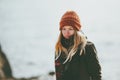 Woman at winter beach cold sea outdoor wearing hat and scarf sad depression emotions Lifestyle Royalty Free Stock Photo