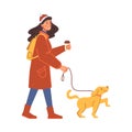 Woman in winter cloth walking with dog and drink coffee