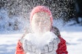 Woman In Winter Clothes Blowing Snow Royalty Free Stock Photo