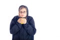 Woman in winter jacket holding mug with hot drink. Royalty Free Stock Photo