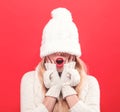 Woman with winter knit hat pulled over her eyes