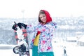 Young woman holding snowboard on her shoulders Royalty Free Stock Photo