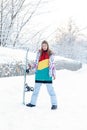 Young woman holding snowboard on her shoulders Royalty Free Stock Photo