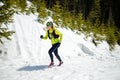 Woman winter running in beautiful inspirational landscape