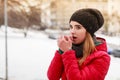 Woman during winter warming up her hands