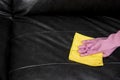 Woman wipe sofa with germicidal spray and wipe with towel Royalty Free Stock Photo