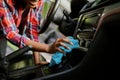 Woman wipes car interior with rag, hand auto wash Royalty Free Stock Photo