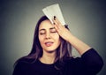 Woman wipes sweat from her forehead with a handkerchief Royalty Free Stock Photo