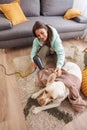 Woman wiping and drying her dog after a bath Royalty Free Stock Photo