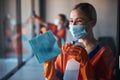 Woman wiping the glass surface with an absorbent cloth Royalty Free Stock Photo