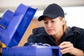 woman wiring up electric junction box