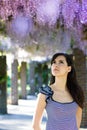 Woman with wisteria flowers. Spring