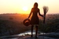 Woman in a witch costume with a broom and hat, a background of h Royalty Free Stock Photo