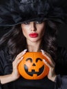 Witch with Halloween pumpkin Royalty Free Stock Photo