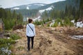 Woman witnessing deforestation aftermath