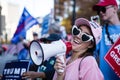 A Woman in a `Women for Trump` Hat Speaks Into a Megaphone at a Stop the Steal Rally